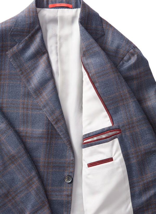 Close up of ISAIA sports coat focused on inside lining and pockets